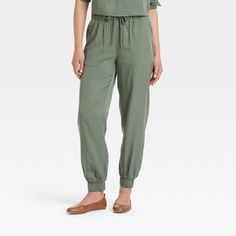 Women's High-Rise Joggers - Universal Thread™ Olive Green S Casual Solid Viscose Bottoms, Casual Stretch Viscose Pants, Casual Viscose Bottoms, Casual Viscose Loungewear Bottoms, Casual Viscose Long Pants, Relaxed Fit Viscose Bottoms With Elastic Waistband, Solid Viscose Bottoms With Elastic Waistband, Spring Joggers With Elastic Waistband For Elevated Casual Wear, Solid Color Viscose Bottoms With Elastic Waistband