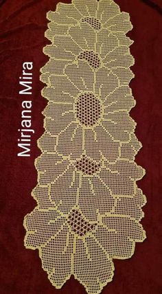 a crocheted doily is shown on a red cloth with the words,