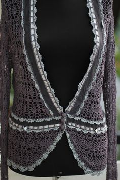 Vintage 90s handmade crochet silky viscose cardigan. Romantic grunge vibes. It have beautiful scalloped edging on waist and sleeves and around the neck in light grey color with a bit of glitter shine. Fishnet detail, gray silky thread, crochet buttons. This cardigan was made with lots of attention to details. Heavy high quality silky and cold on touch material. I would say its mixture of viscose and silk. Fits M and S sizes Measurements: whole length 63 cm armpit to armpit 41 cm waist laying fla Bohemian Crochet V-neck Cardigan, Bohemian V-neck Crochet Cardigan, Summer Fitted Crochet Lace Cardigan, Fitted Crochet Lace Summer Cardigan, Fitted Crochet Lace Top For Layering, Fitted Bohemian Crochet Top For Fall, Hand Knitted Bohemian Crochet Top, Fitted Summer Cardigan With Crochet Trim, Summer Fitted Cardigan With Crochet Trim