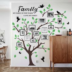 the family tree wall decal has many pictures on it