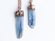 Kyanite crystal necklace | Raw kyanite jewelry | Kyanite crystal pendant | Blue kyanite pendant | Rough kyanite jewelry | Kyanite necklace This listing is for one small kyanite crystal electroformed and strung on an 18" copper chain. Our jewelry is unique and one-of-a-kind. Please note there will likely be variances in the size, shape and color of each stone. All elements of your piece are handcrafted in our tiny studio on the island of Martha's Vineyard. Your jewelry will arrive ready for gift- Kyanite Necklace, Rough Quartz, Kyanite Jewelry, Kyanite Crystal, Raw Gemstone Jewelry, Tiny Studio, Raw Crystal Necklace, Quartz Crystal Pendant, Les Chakras