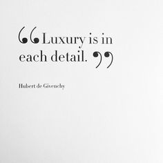 a white book with black lettering on the front and back cover that says luxury is in each detail