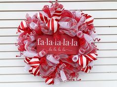 a red and white wreath with the word falafadia written on it in spanish