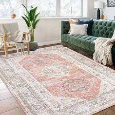 a living room filled with furniture and a large rug