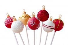 an assortment of christmas ornaments on toothpicks