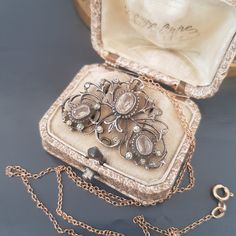 "Antique openwork sterling silver pendant with glass paste stones.  French work, regional jewelry from the 19th century.  Dimensions: 4.2 x 3 cm 1.6\" x 1.2\"  Good antique condition, beautiful original patina. Sold without chain.  I'm happy to combine shipping costs if you buy more than one item. Import duties, taxes, and charges are not included in the item price or shipping cost. These charges are the buyer's responsibility. Please check with your country's customs office to determine what th Antique Pendant Brooch With Intricate Design, Antique Brooch With Intricate Pendant Design, Victorian Brooches With Locket Pendant, Victorian Locket Pendant Brooches, Ornate Collectible Rose Cut Diamond Jewelry, Ornate Rose Cut Diamond Collectible Jewelry, Ornate Rose Cut Diamonds Jewelry Collectible, Ornate Rose Cut Diamonds Jewelry For Collectors, Ornate Rose Cut Diamond Pendant Jewelry