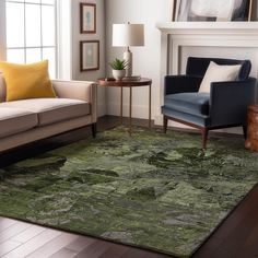 a living room filled with furniture and a green rug on top of a hard wood floor