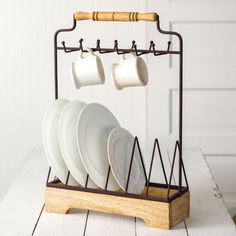 a rack with plates and cups on it