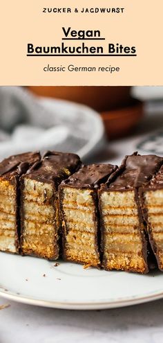 a plate topped with slices of cake covered in chocolate