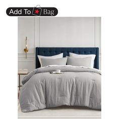 an image of a bed with white sheets and pillows