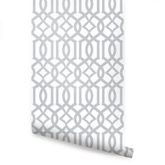 a white and grey wallpaper with an intricate design