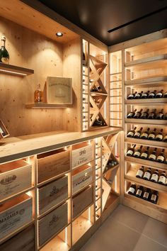 a wine cellar with lots of bottles in it