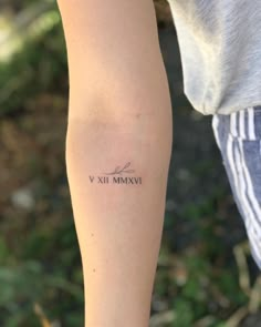 a person with a tattoo on their arm that says vix mammavi in cursive writing