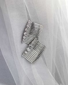 These hair combs are perfect for brides, bridesmaids, or any special event. A simple design of round-cut crystal stones lined up to shine! Sold in sets of two.

Austrian crystal stones
rhodium plated brass
2 1/8 inches by 3/8 inches high