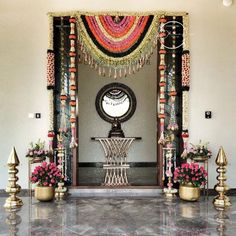 an entrance decorated with flowers and decorations