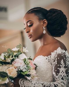 a woman in a wedding dress holding a bouquet