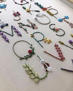 many different types of bracelets laid out on the floor