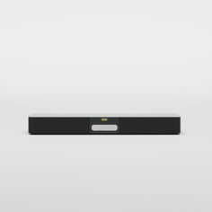 the sound bar is black and white with yellow accents on it's front end