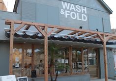 the front of a store that sells wash and fold