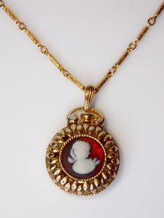 This vintage necklace from Sarah Coventry is a stunning piece of jewelry that features a beautiful cameo perfume locket pendant and adds a touch of elegance to any outfit.  You will receive: (What you see in the images) - 1 Vintage Cameo Perfume Locket Pendant Sarah Coventry  - Chain is 24" - Pendant is 1 3/8" inches Contact me through Etsy messaging with any questions. All vintage items are hand picked for quality and uniqueness, so you can feel special wearing an authentic piece of the past. T Elegant Vintage Charm Locket Necklace For Formal Occasions, Elegant Locket Necklace With Vintage Charm For Formal Occasions, Elegant Formal Locket Necklace With Vintage Charm, Cameo Medallion Locket Necklace, Vintage Collection Cameo Medallion Locket Necklace, Vintage Medallion Cameo Locket Necklace, Vintage Collection Medallion Cameo Locket Necklace, Antique Gold Cameo Pendant Necklace, Vintage Wedding Locket Pendant Necklace