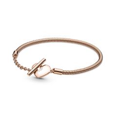 Add a warm-toned accent to your look with the Pandora Moments Heart T-Bar Snake Chain Bracelet. Hand-finished in a 14K rose gold-plated unique metal blend, this piece is an updated take on the Pandora Moments snake chain bracelet. Featuring a heart-shaped T-bar double circle closure, loop the T-bar through the smallest circle to guarantee that the bracelet clasp is securely closed. Wear this sleek, modern style with up to 10-13 Pandora Moments charms and dangles. Bracelet Pandora, Snake Chain Bracelets, Snake Bracelet, Silver Snake Chain, Bar Bracelets, Gold Bracelet Chain, Pandora Bracelets, The Avengers, Pandora Bracelet