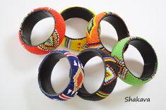 African tribal beaded bracelets African jewelry handmade bangles multicolored bangles African fashion tribal bracelets accessories gift PRODUCT SPECIFICATIONS: Bracelet inner diameter - 7.0 cm Colors - multiple colors Materials - beads, plastic tube ADDITIONAL INFORMATION New and unworn: Yes Handmade in Kenya: Yes Other jewelry in my shop: https://www.etsy.com/shop/shakava Traditional Multicolor Beaded Bangle Bracelets, Multicolor Festival Bangle Bracelet, Multicolor Beaded Bangle, Multicolor Round Beads Bangle For Festival, Bohemian Multicolor Round Beads Cuff Bracelet, Bohemian Bangle With Colorful Beads, Bohemian Handmade Bangle With Round Beads, Multicolor Festival Bangle Jewelry, Handmade Bohemian Bangle With Round Beads