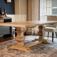 a wooden table sitting on top of a rug