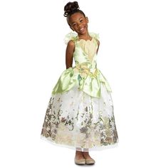 This beautiful Disney Tiana Deluxe costume for girls will instantly transform you from frog to princess! If your favorite Disney princess is Tiana from The Princess and the Frog, you're not going to want to miss out on this dazzling costume that features a breathtaking green gown with lotus details and a character cameo for a complete transformation. Princess And The Frog Dress, Tiana Outfit, Princess Tiana Costume, Princess Tiana Dress, Disney Princess Halloween Costumes, Tiana Costume, Princess Dresses For Girls, Disney Princess Halloween, Disney Tiana