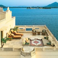 an outdoor seating area overlooking the water