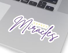 an image of stickers on the back of a laptop computer that says expect miracles