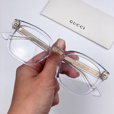 Gucci Gg0184o 011 Eyeglasses Crystal Clear Gold Square Unisex Brand - Gucci Model - Gg0184o Color Code - 011 Gender - Unisex Frame Colour - Crystal Clear Gold Frame Shape - Square Frame Style - Full Rim Frame Material - Acetate Lens Color - Demo Uv Protection - Category 3 Size - 50/21/145 100% Uv Protection Authentic! Full Retail Package With All Accessories. Have All Colors Of Gucci Cases In Stock. Feel Free To Message Me The Color Of Case You Would Like To Get When Making A Purchase. Made In I Luxury Clear Gucci Sunglasses, Gucci Designer Clear Sunglasses, Designer Gucci Clear Sunglasses, Gucci Clear Glass Sunglasses, Elegant White Gucci Sunglasses, Gucci Model, Gucci Models, Square Frame, Color Crystal