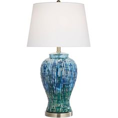 a blue lamp with a white shade on it