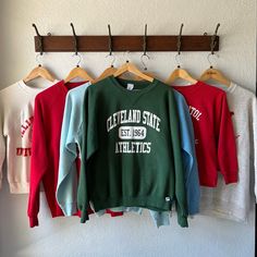 "Listed are an assortment of pull over crew neck sweatshirts 1. Cleveland State Athletics - Large green 2. Erwin Street School flocked on 60's 70's collegiete pacific tag pit 22\" x length 23\" - baby blue 3. St.Anthony's School - XL Red Tiger 4. UNLV Rebels - XL pit 24\" x length 28\" - grey & red 5. US Capitol Washington DC Size Medium pit 19\" x length 19\" - red & white 6. Virginia Beach -. XL Baby Blue with bleach spot and a couple pin holes 7. Illinois State University Size Medium (70's 80 Mens Western Jeans, Illinois State University, St Anthony's, School Sweatshirts, Fresno State, Western Jeans, Red Tiger, Us Capitol, School Education