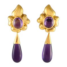 Opulent 18K Yellow Gold and captivating Amethyst gemstones come together beautifully on these enchanting earrings. Each one measures 2.5 long by 0.85 long, making them an ideal size for any occasion.This jewelry piece is offered in estate condition and includes a gift box.e Amethyst Flower, Flower Drop Earrings, Deco Luminaire, Bracelet Love, Baccarat, Come Together, Amethyst Gemstone, Hermes Birkin, Girls Best Friend