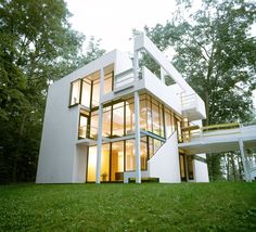 a white house with stairs leading up to it