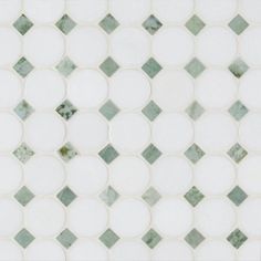 a white and green mosaic tile pattern