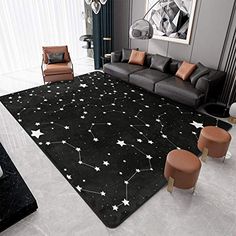 a living room filled with black furniture and stars on the rug in front of a couch