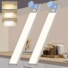 two lights that are on top of a counter