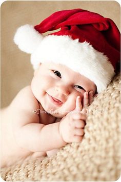 a baby wearing a santa hat with the caption,'never miss an opportunity to tell someone you love them '