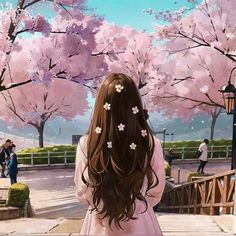 a girl with long brown hair standing in front of pink cherry blossom trees and looking at the ground