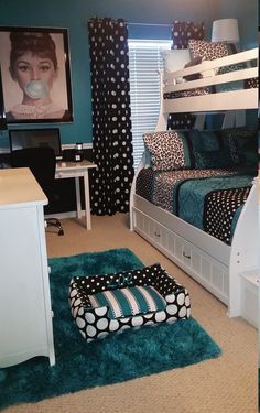 a bedroom with bunk beds and blue walls