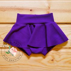 Adorable handmade purple bummie skirt for baby girls. Hair bow comes on a nylon headband. Baby skirts run true to size.  Please order the size that your child is currently wearing. Newborn - 5-8lbs 0-3 months - up to 9lbs 3-6 months - up to 12.5lbs 6-9 months - up to 16.5lbs 9-12 months - up to 20.5lbs 12-18 months - up to 24.5lbs 18-24 months - up to 27.5lbs 24 months - up to 30lbs Click to view more items available: www.etsy.com/shop/emmarosebabyboutique *Fabric placement may vary slightly fro Cute Fitted Shorts With Elastic Waistband, Cute Stretch Bottoms, Fitted Bottoms With Built-in Shorts In Cute Style, Cute Fitted Solid Bottoms, Cute Fitted Bottoms With Built-in Shorts, Purple Short Skort For Summer, Purple Short Skort For Spring, Purple Party Bottoms Short Length, Purple Short Bottoms For Party