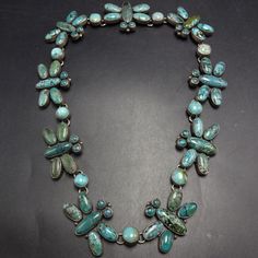 FEDERICO JIMENEZ TURQUOISE CLUSTER BUTTERFLY NECKLACE DESCRIPTION: This is an exquisite necklace by legendary Oaxacan artisan Federico Jimenez.    Federico always utilizes the finest natural turquoise, much of it from old mines and collections long since depleted.    FEDERICO JIMENEZ was born in Oaxaca, Mexico in 1941 in a Mixtec Indian Community.  He came to the USA in 1967 to study and work.  He studied jewelry making and design at the University Community School.  In 1970 He and his Wife Elle Turquoise Butterfly, Community School, Jewelry Picture, Taos, Wedding Jewellery Necklace, Butterfly Necklace, Natural Turquoise, Native American Jewelry, Silver Turquoise