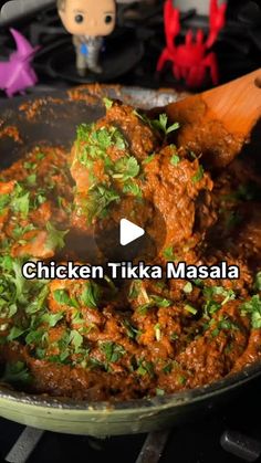 chicken tikka masala being cooked in a skillet