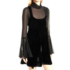 Description Bring Out Your Inner Romantic In The Free People Counting Stars Black Velvet Long Sleeve Babydoll Dress! Ultra-Soft Velvet Shapes Wide Straps And A Square Neckline, Above A Semi-Sheer Chiffon Lining, With A Tying Mock Neck, Plus Long Sleeves With Exaggerated, Drawstring Flounce Cuffs. Empire Waist And Babydoll Silhouette. Back Cutout And Exposed Double Button Closures. Pit To Pit 17" Length 33.5" Fit Bust: Great For Any Cup Size. Waist: Loosely Fitted. Hip: Not Fitted - Room For Hips Long Sleeve Babydoll Dress, Counting Stars, Sheer Chiffon, Sheer Dress, Babydoll Dress, Free People Dress, Fit And Flare Dress, Empire Waist, Black Velvet