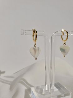 White Drop Huggie Earrings, White Huggie Earrings As Gift, White Dainty Earrings With Heart Charm, White Heart-shaped Pearl Earrings Gift, Nickel-free White Huggie Earrings For Gifts, Dainty White Heart Earrings For Pierced Ears, White Dainty Heart Earrings For Pierced Ears, White Heart-shaped Pearl Drop Earrings, White Heart-shaped Pearl Earrings For Pierced Ears