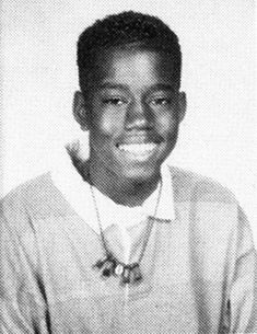 a black and white photo of a young man