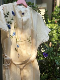 ❤ The beige linen hand embroidered dress is very soft, skin friendly, breezy and comfortable.  ❤ Item description: - A lovely dress with embroidered butterfly pea flower motifs. - Has 2 hidden sides pockets and 1 linen belt. - Material: linen, embroidery threads. - Environmentally friendly. - This dress is very useful, go with any outfit, that can be used to go to school, go out, go shopping.    It is a perfect gift for yourself or your beloved.  ❤ Care instructions:       The best way to wash embroidery cloth is to put it in soapy water (with a mild detergent and cold water at 86 ºF/30oС) for 20 minutes. Try to not wash the item with other clothing that might cause damage, such as zippers, buttons or different colors. You wash it by hand, and if you have dirty patches on your garment, you Beige Linen Dress With Floral Embroidery, Beige Embroidered Summer Dress, Summer Beige Embroidered Dress, Beige Floral Embroidered Dress For Summer, Beige Floral Embroidered Summer Dress, Embroidered Linen Dress For Summer Garden Party, Beige Linen Dress For Spring Garden Party, Elegant Summer Linen Dress With Floral Embroidery, Cream Embroidered Cotton Summer Dress