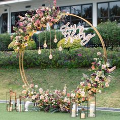 a wedding arch decorated with flowers and candles