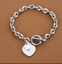 Stylish silver chain link charm heart bracelet  Great gift for birthday, anniversary, child, friend, and any occasion  Built for durability and long lasting wear. Trendy Silver Heart Bracelet For Friendship, Metal Charm Bracelet With Heart Charm For Mother's Day, Trendy Silver Chain Bracelet Perfect For Gifts, Trendy Silver Chain Bracelet As Gift, Everyday Silver Heart Bracelet With Adjustable Chain, Trendy Silver Chain Bracelet, Mother's Day Metal Charm Bracelet With Heart Charm, Mother’s Day Metal Charm Bracelet With Heart Charm, Mother's Day Heart-shaped Metal Charm Bracelet